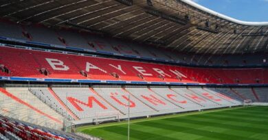 Explore the iconic Allianz Arena in Munich, home to FC Bayern, captured empty and sunlit.